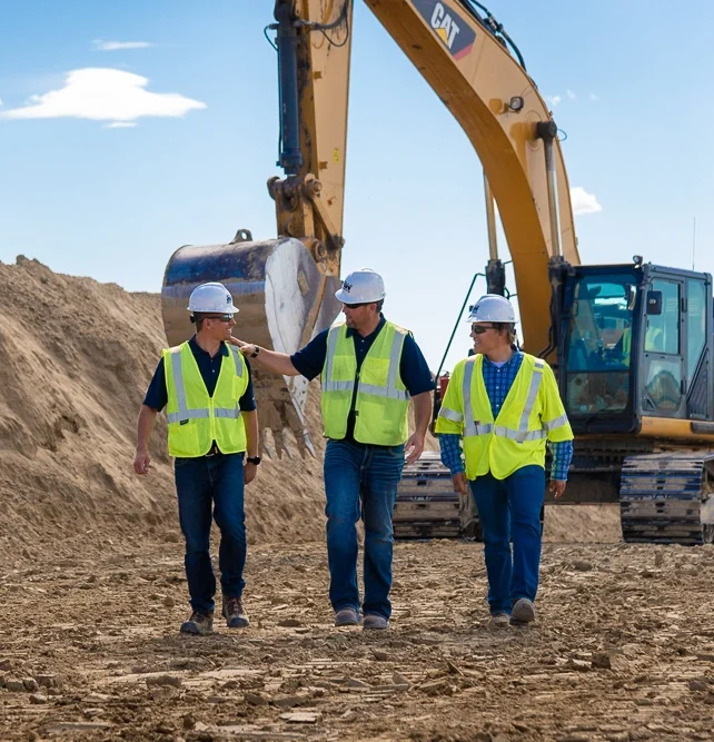 Construction site photography: Workers in Wyoming with excavator, Altitude Arts Photographics.