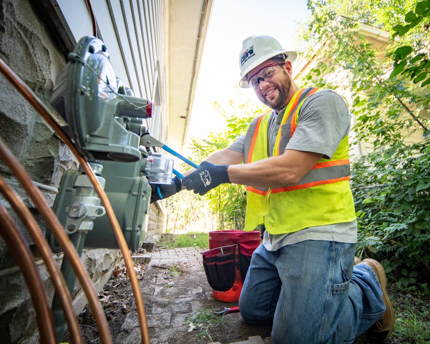 Black Hills Energy worker repairing gas meter, brand photography by Altitude Arts, Denver.