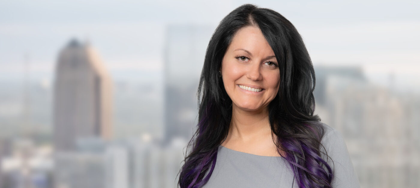 Professional headshot of Elizabeth Streible, remote associate, smiling in Denver office, Altitude Arts Photographics.