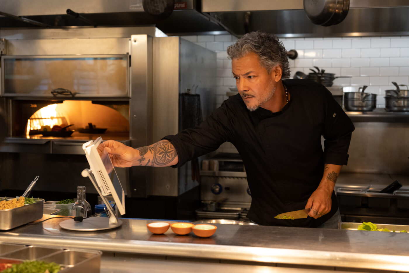 chef owner looking at clover recipe display - professional photographer denver