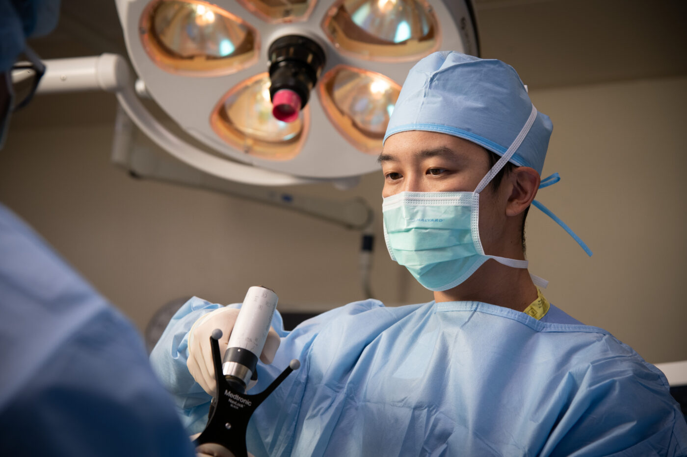 Asian surgeon performing robotic surgery at Good Samaritan Hospital, Denver Colorado.