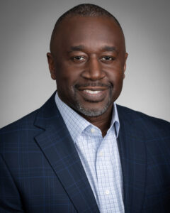 african american professional solopreneur headshot on grey backdrop