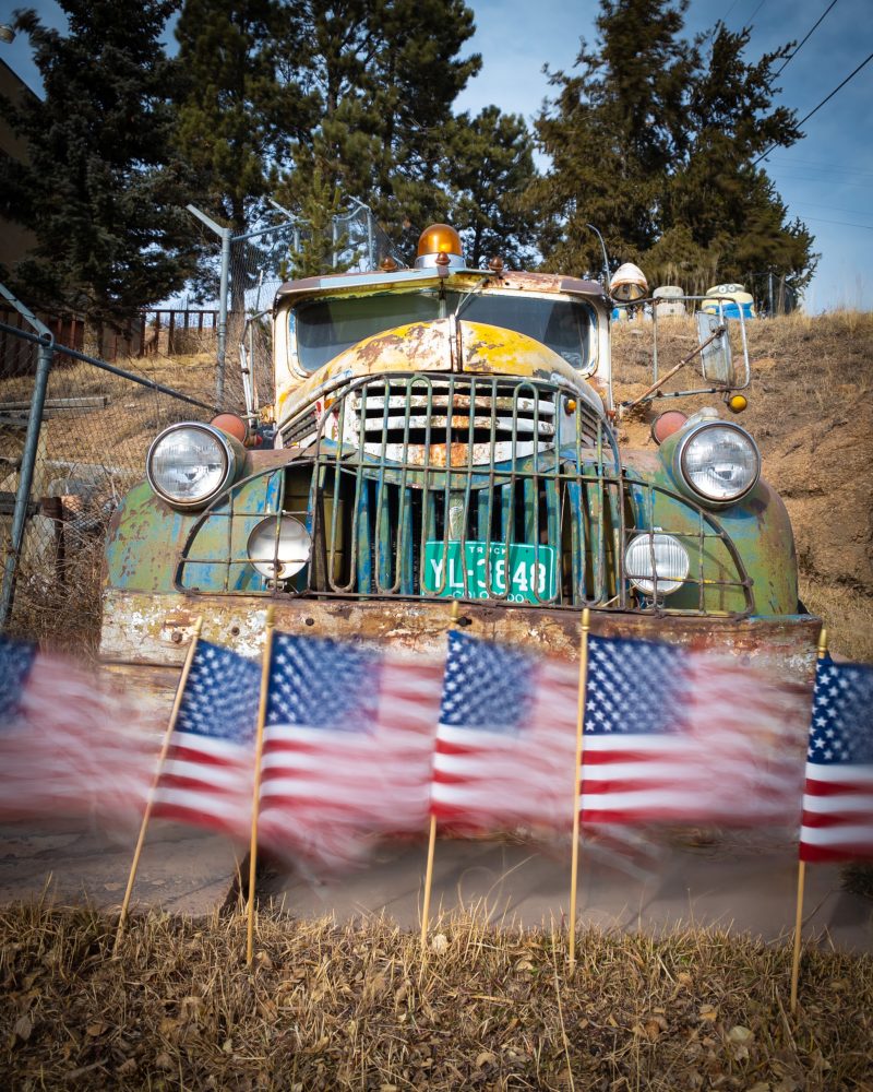 vintage red and white car in front of old motel