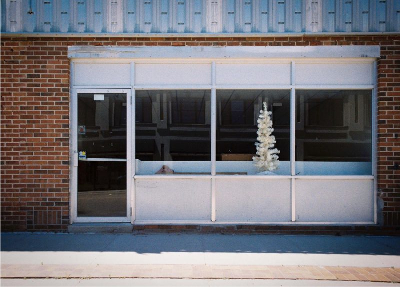vintage red and white car in front of old motel